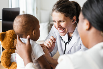 Doctor smiling at baby